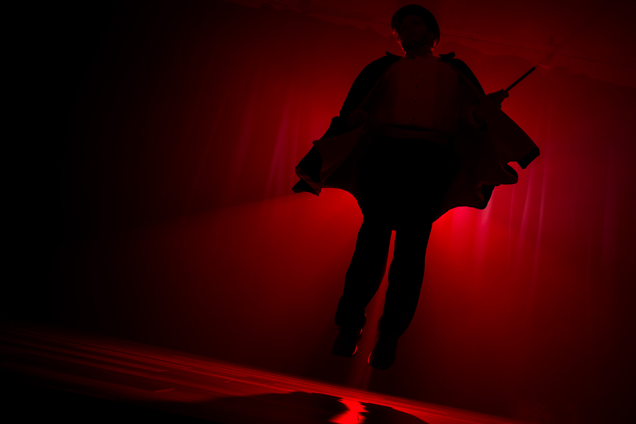 Magician floating off stage after a short performance