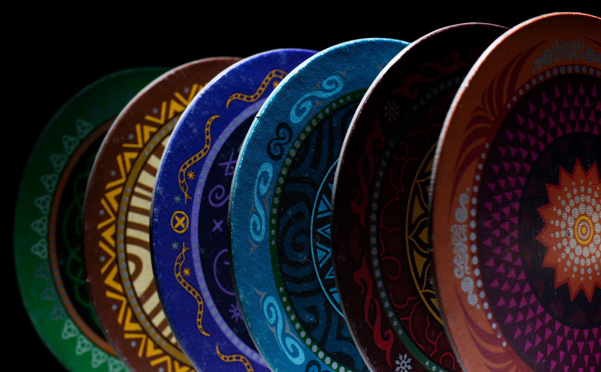 Coaster shaped player tiles from the bluffing game Skull
